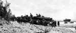 US Army soldiers disembarking from LVTs onto Okinawa beach, Japan, circa Apr 1945