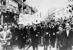 Civilians celebrating the British declaration of war on Germany, Warsaw, Poland, 3 Sep 1939; translation of the banner 