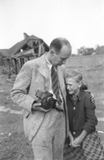 Photographer Julien Bryan comforting ten-year-old Polish girl Kazimiera Mika whose sister had just been killed by strafing German aircraft, near Jana Ostroroga Street, Warsaw, Poland, 13 Sep 1939