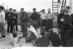 Germans guarding British prisoners of war, Saint-Nazaire, France, 28 Mar 1942, Photo 1 of 2