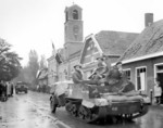 Canadian Royal Hamilton Light Infantry carriers moving through the Dutch village of Krabbendijke on the Beveland Causeway, 27 Oct 1944