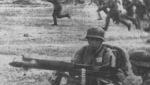 Machine gun crew of Chinese 88th Division covering an infantry advance, Shanghai, China, Sep-Oct 1937; note Germany-supplied helmets