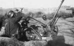 Chinese anti-aircraft position, Shanghai, China, 1937; note German-style helmet and Italian Breda Model 35 anti-aircraft gun