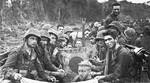 US Marines displaying a captured Japanese flag, New Britain, Bismarck Archipelago, late Jan 1944