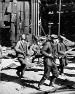 Russian factory workers with small arms in Stalingrad, Russia, 1942-1943