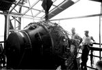 Physicist Norris Bradbury (left) with atomic bomb 