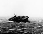 USS Langley in heavy seas in the South China Sea in the morning of 13 Jan 1945. Note the trailing USS Washington riding the storm much better.