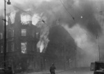 Burning residential building at the intersection of Zamenhofa and Wolynska Streets in Warsaw, Poland, Apr-May 1943