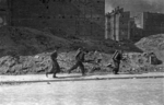 Polish insurgent fighters with flame throwers on Sienna Street, Warsaw, Poland, Aug 1944