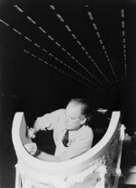 Worker scraping a plaster cast for plexiglass for PV-1 turrets, Lockheed factory, Burbank, California, United States, Aug 1943