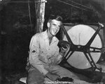 USAAF 3rd Bomb Group photographer George Tackaberry eating cake, Nadzab Airfield, Australian New Guinea, early 1944