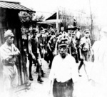 Former American captives departing a prisoner of war camp, Taiwan, 5 Sep 1945