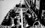 African-American crew of US Navy submarine chaser PC-1264 saluting the American flag, east coast of United States, 1 May 1944