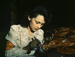 American female aircraft worker working at the Vega Aircraft Corporation, Burbank, California, United States, Jun 1942