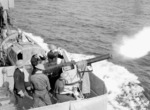 2-pounder anti-aircraft gun aboard HMCS Assiniboine firing in exercise en route between Halifax, Nova Scotia, Canada and Britain, 10 Jul 1940