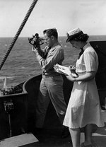 A WAVES ensign timing the sights for USS General Omar Bundy