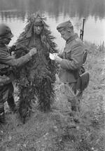 Finnish Army Major Major Martti Aho interrogating a captured Soviet soldier, Jessoila, Karelia, Finland, Aug 1941