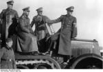 Keitel, Hitler, and Speer observing the field during a weapons demonstration, circa 6 Apr 1943