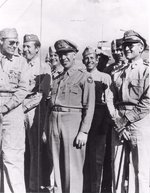 American officers LtCol Richard H Carmichael, 19th Bomb Group CO, MGen George C Kenney, 5th Air Force CO, and BGen Kenneth N Walker, V Bombing Command CO at Port Moresby, New Guinea, 1942