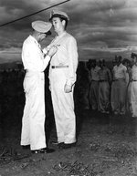 George Kenney decorating USAAF 3rd Bomb Group airman Jock Henebry, Nadzab Airfield, Australian New Guinea, Feb 1944