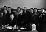 Soviet Foreign Minister Vyacheslav Molotov signing the Soviet-Japanese Neutrality Pact, Moscow, Russia, 13 Apr 1941; note Yosuke Matsuoka and Joseph Stalin in background