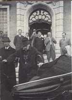 German President Hindenburg getting into his car with help from his son Oskar, at his country residence in Neudeck, East Prussia, Germany (now Ogrodzieniec, Poland), 1934; note Papen in background