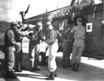 Major General Lewis Puller fastening his life preserver before boarding a helicopter, Roosevelt Roads Naval Base, Puerto Rico, 26 Jul 1954