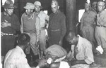 US General Daniel Sultan, Chinese General Sun Li-jen, and medical doctor Gordon Seagrave visiting wounded Chinese troops in a field hospital, Burma, 1940s