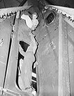 Ship fitters working on battleship Alabama, Norfolk Naval Shipyard, Portsmouth, Virginia, United States, 1940-1942