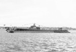 Tugboat pushing submarine Gar to the fitting dock immediately after launching, Groton, Connecticut, United States, 7 Nov 1940