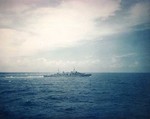 HMAS Hobart (foreground) and either HMAS Australia or HMAS Shropshire (background) in exercise in the South China Sea off Subic Bay, Philippines, circa Aug 1945, photo 1 of 2