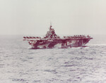 USS Hornet in camouflage Measure 33 Design 3a off Okinawa, Japan, 27 Mar 1945; note various aircraft on the flight deck