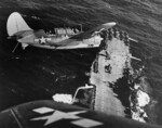 Helldiver aircraft over Hornet, South China Sea, mid-Jan 1945, photo 1 of 2