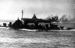 Intrepid burning after special attack, off Okinawa, Japan, 16 Apr 1945; a Fletcher-class destroyer in foreground