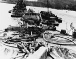 Kikuzuki under salvage, Ghovana Bay, Florida Islands, 10 Aug 1943, photo 2 of 2; note barge with crane on the right side of the photograph and USS Menominee aft of Kikuzuki