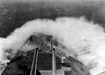 Waves splashing onto the bow of HMS London, possibly in the Norwegian Sea, circa early- to mid-1942