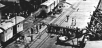 Wounded sailors being taken off of USS Marblehead, Tjilatjap, Java, Dutch East Indies, 4 Feb 1942; seen in Jul 1963 issue of US Navy publication All Hands