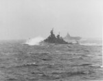 USS New Jersey (foreground) and USS Hancock (background) in a storm, western Pacific Ocean, 8 Nov 1944; photograph taken from USS Intrepid