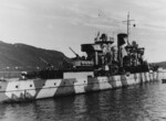 German anti-aircraft ship Nymphe, Norway, 1940; note camouflaged 105mm anti-aircraft guns and crewmen gathered on the deck