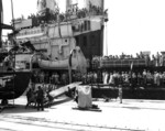 Japanese working party rigging the gangway for USS San Diego, Yokosuka, Japan, 30 Aug 1945