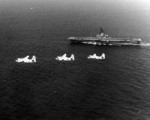 Three S-2E Tracker aircraft flying past anti-submarine warfare carrier Ticonderoga off San Diego, California, United States, late 1971