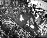 Hula dancers entertain returning Japanese-American veterans of US 442nd Regimental Combat Team aboard Victory Ship USS Waterbury Victory, Honolulu, US Territory of Hawaii, 9 Aug 1946; photo 4 of 7