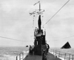 USS Wahoo at sea off Midway Atoll, 6 Apr 1943. Note that censors have blacked out the escorting vessels.