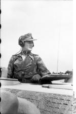 A German Jagdpanther tank destroyer crewman atop the vehicle during the Allied invasion of France, Jun 1944 