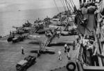 Jeep vehicles and SBD Dauntless aircraft aboard an aircraft carrier in the Solomon Islands area, 5 Nov 1943