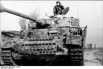 Tank commander and his Panzer IV tank of German 12th SS Panzer Division 