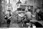 German anti-tank guns (rebuilt French R35 light tanks), motorcycles, and horse carts moving through a forest in northern Russia, summer of 1941