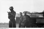 German anti-aircraft gunners near a SdKfz. 251 halftrack vehicle for field medics, Russia, Jun 1941, photo 1 of 2