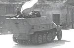 Polish resistance fighters with captured German SdKfz. 251 halftrack vehicle, Na Skarpie Boulevard, Warsaw, Poland, 14 Aug 1944