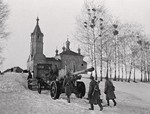 Soviet A-19 field gun being towed by a tractor in the village of Izvekova near Vyazma, Russia, 1 Mar 1943